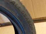 a close up of a tire on a cardboard box with a cardboard box in the background