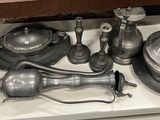 a tray with silver objects on it on a table