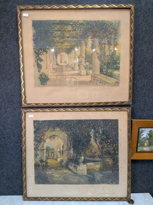 two paintings on display on a table next to a picture