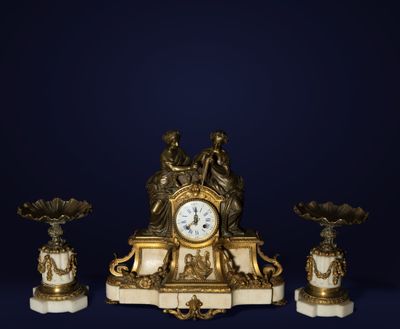 a clock sitting on top of a table next to three vases