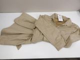 a pile of clothing on a table with a price tag on it