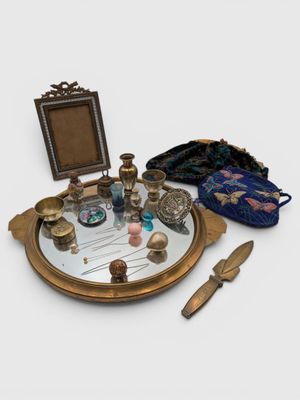 a mirror, a purse, and a mirror on a table