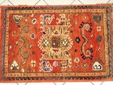 an orange rug with a design on it on a white floor