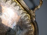 a silver tray with a handle on it