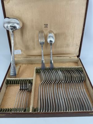 a wooden box with silverware in it on a table