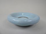 a blue bowl that has a diamond in it