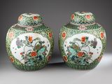 pair of chinese vases with flowers and birds on them