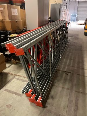 a large metal structure in the middle of a warehouse
