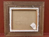 un vieux cadre avec un morceau de papier collé dessus