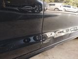 a close up of a car door with a hole in the side