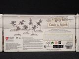 the back of a box with a bunch of figurines in it