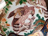a large blue and white vase with a bird design on it
