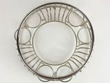 silver plate with roman numerals on it on a white surface