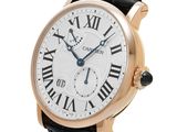 a close up of a wrist watch with roman numerals on it