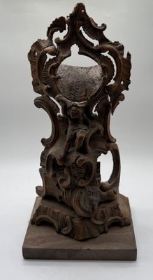 an image of a wooden table with a vase on top of it