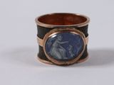 a picture of a ring with a picture of a woman on it