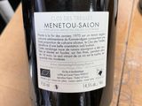 a bottle of wine that is sitting on a table
