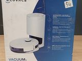 La boîte du robot aspirateur-laveur est ouverte sur la table.