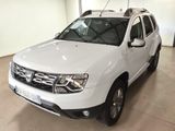 the white dacia is parked in the garage of a building