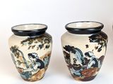three vases sitting next to each other on a white surface