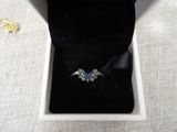 a box with a ring inside of it on a table