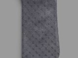 a close up of a tie on a gray background