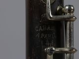 a close up view of a flute with a key on it