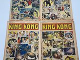 the comics are being displayed on the table in front of the camera