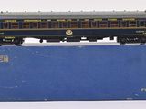 a blue box with a train on it on a white surface