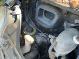 a car engine with the hood up and the hood down
