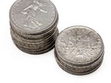 a lot of coins sitting on top of each other