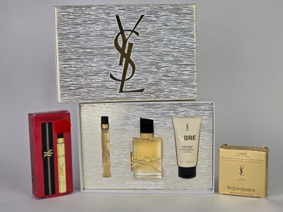 an image of a box containing a bottle of perfume and a bottle of perfume