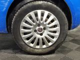 a close up of a tire on a blue car