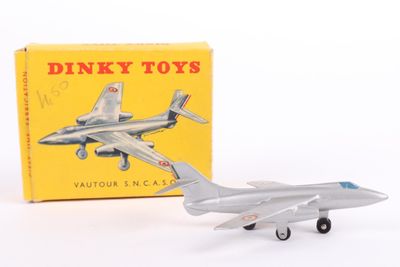 a toy airplane that is sitting next to a box