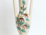 a white vase with a painting of birds on it