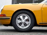 a yellow car that is parked in front of a building