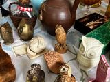 a table with a lot of figurines and vases on it
