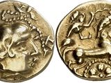 a gold coin with an image of a man riding a horse