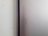 a close up of the back of a silver phone