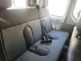a seat in the back of a car with a remote control