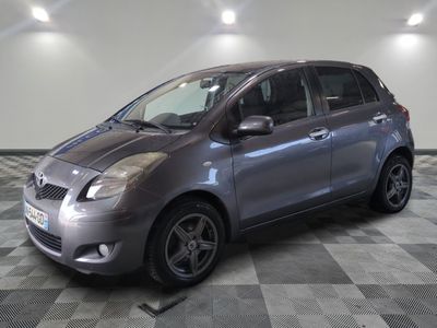 a picture of a silver car parked in a garage