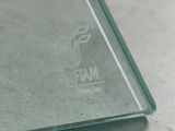 a close up of a glass plate with a logo on it