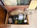 a box full of empty bottles and bottles on the floor