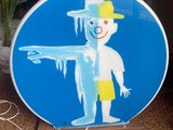 a blue sign with a drawing of a man on it