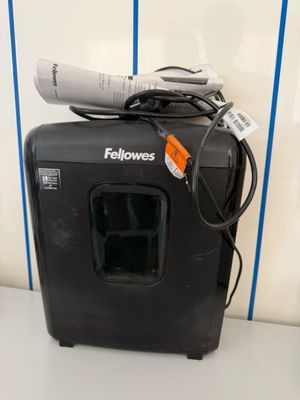 a black microwave sitting on top of a white counter