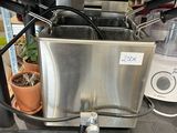an image of a kitchen with a blender and a potted plant