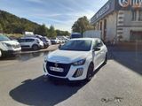 a white car that is parked in front of a building