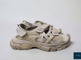 a close up of a pair of shoes on a white surface