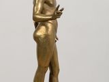 a statue of a man holding a cell phone