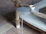 a small table with a cup of coffee on it